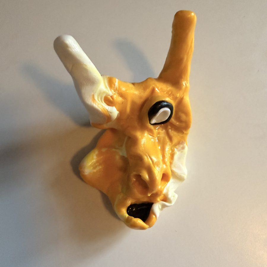 Mr Sandwich, a lumpy clay creature that holds a lighter